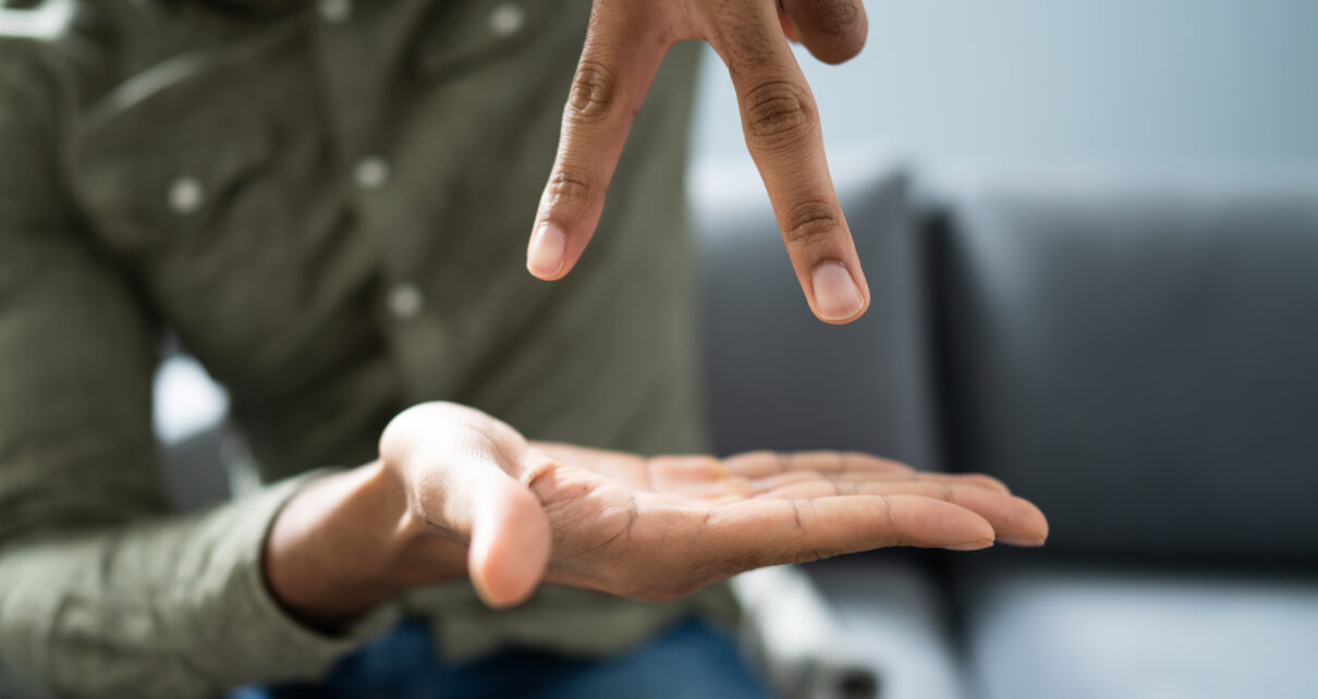 Man Using Sign Language To Communicate