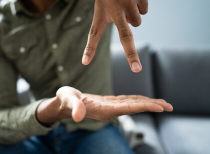 Man Using Sign Language To Communicate